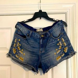 Denim cut offs embroidered Free People shorts.